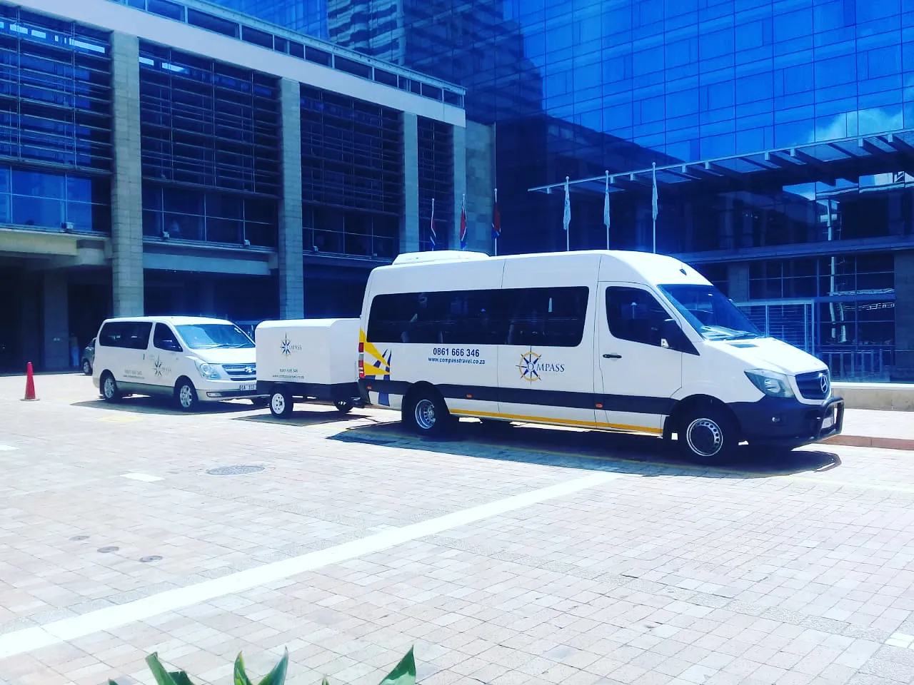 Compass Travel branded vehicles at a Cape Town venue